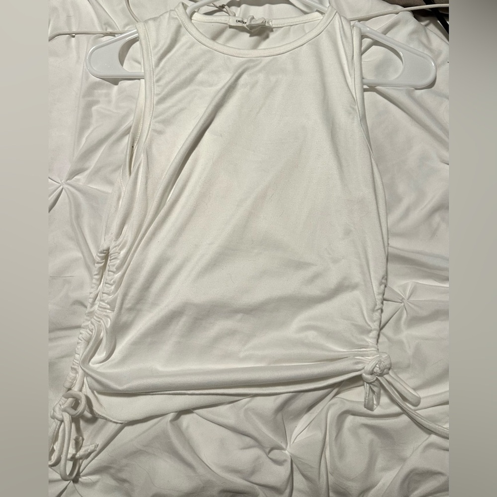 Woman’s white tank